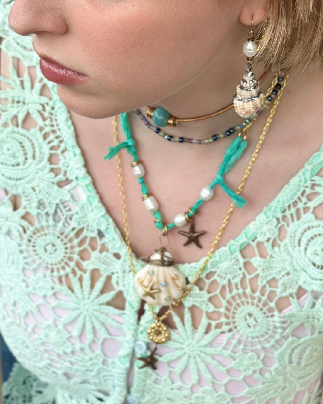 Trendy seashell necklaces on woman