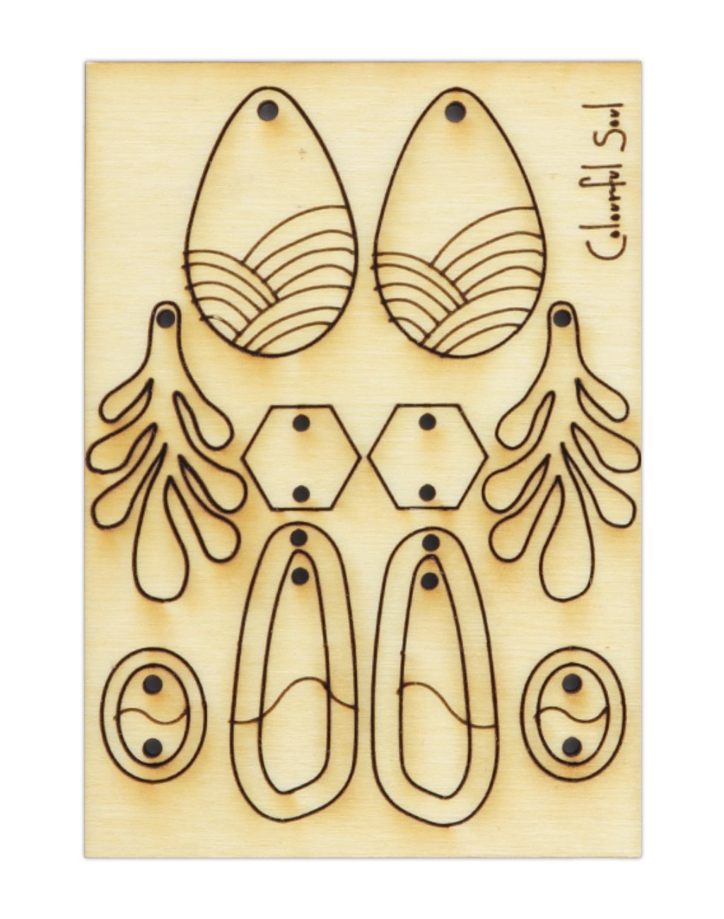 Earrings and jewelry components die cut on wood