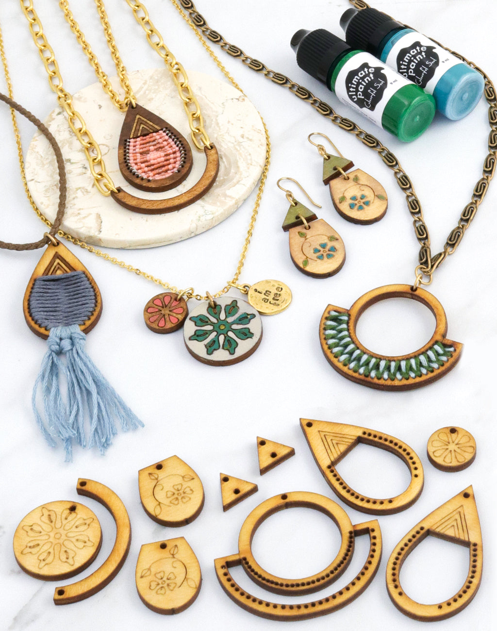 Assorted wooden jewelry and paint bottles
