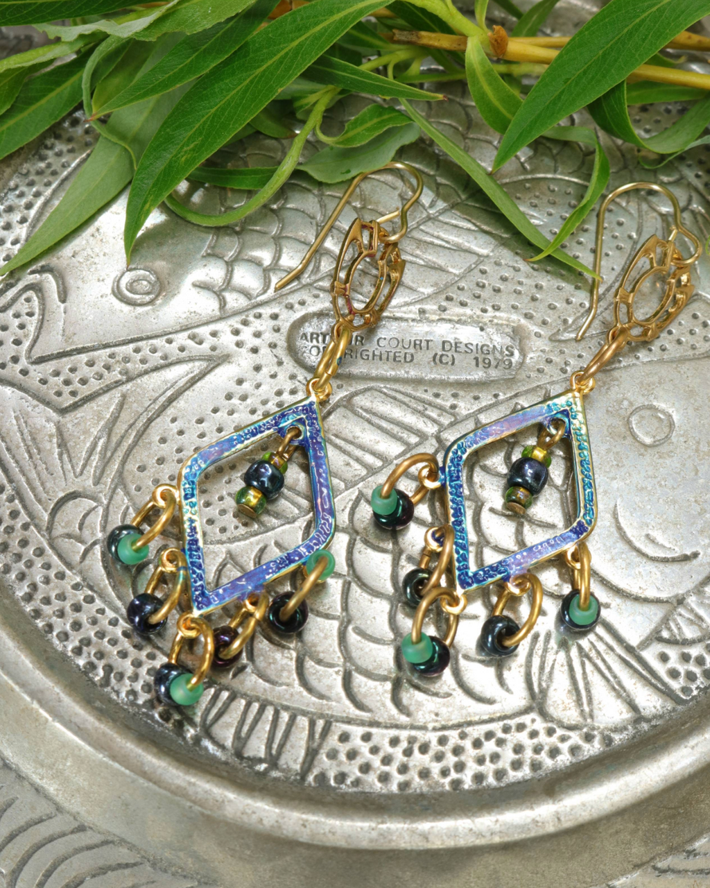 Iridescent diamond earrings with green and black beads