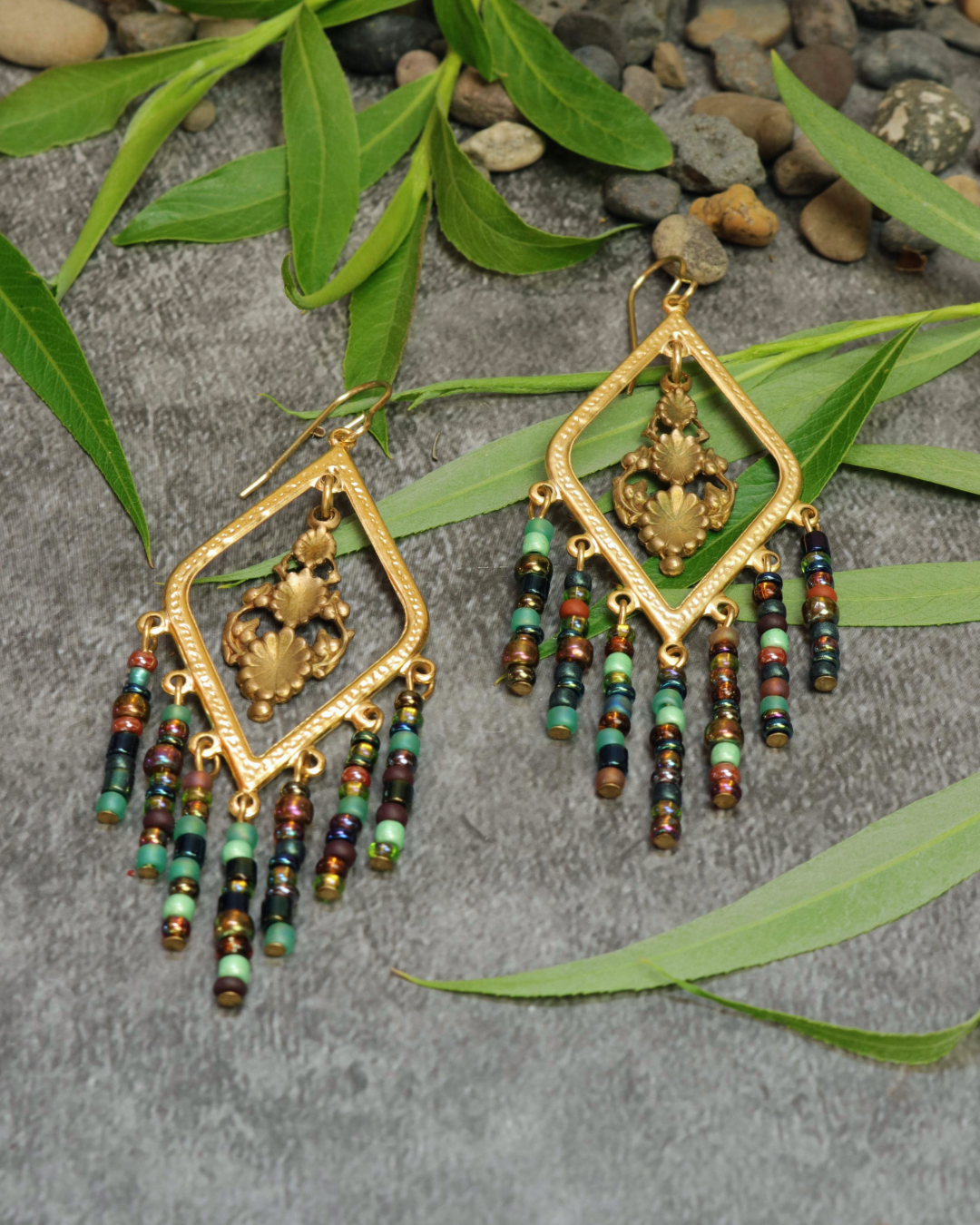 Gold beaded earrings on display