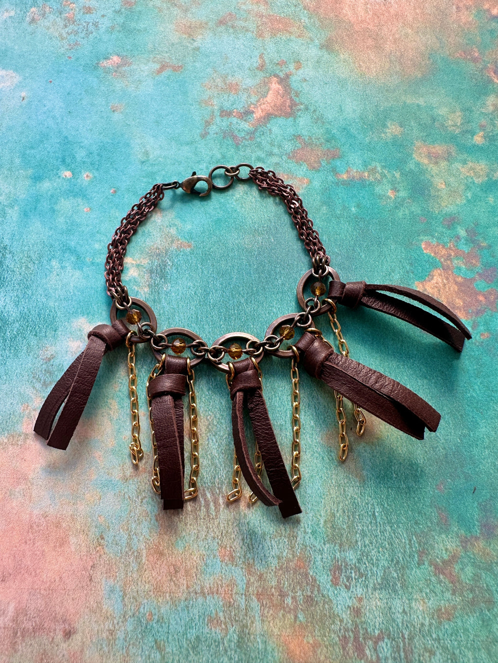Leather tassel bracelet, 6BA39E8F-3A4D-4198-9356-671BE8837302