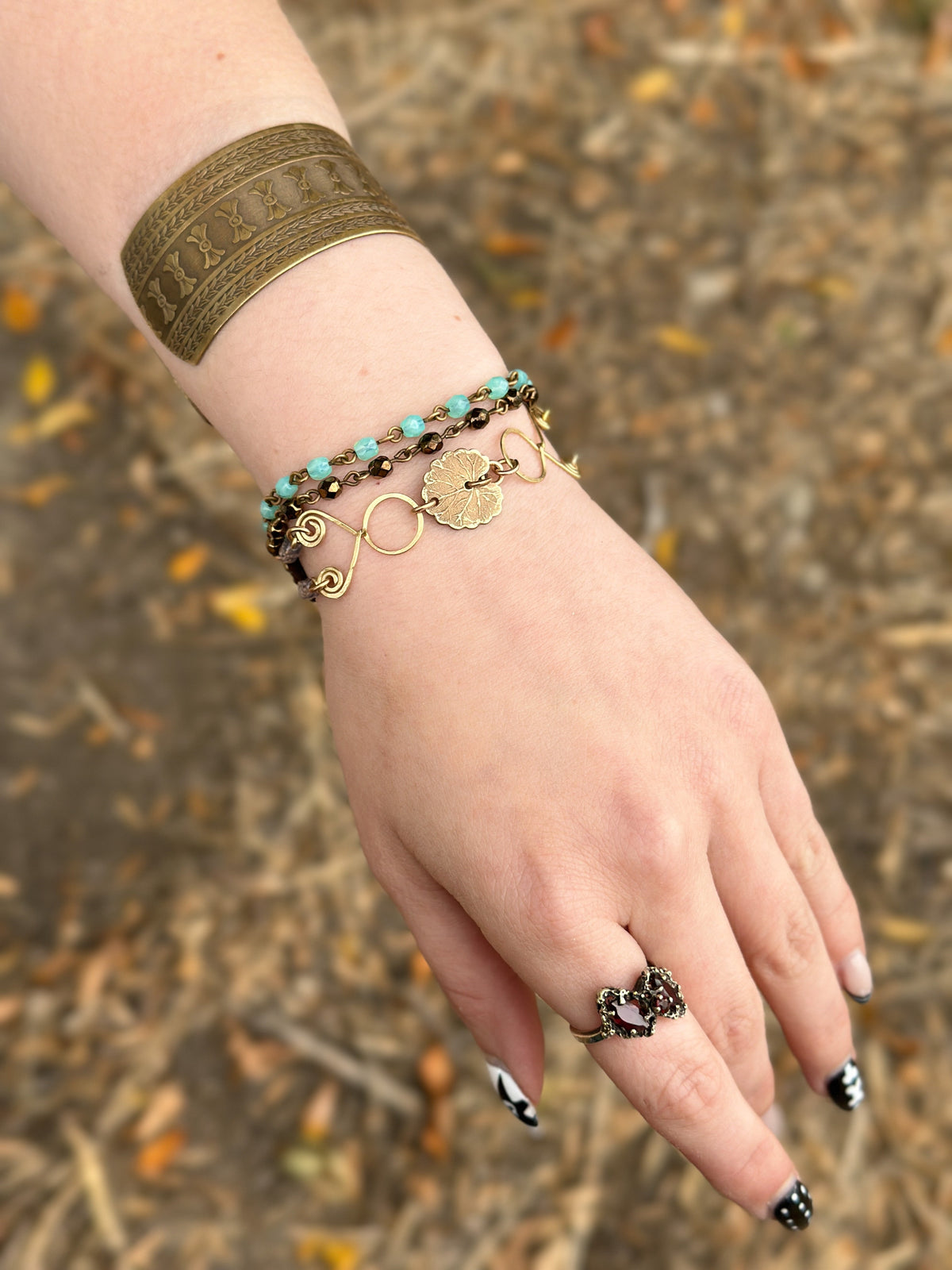 Woman's hand with bracelets and ring, image 938935FF-A262