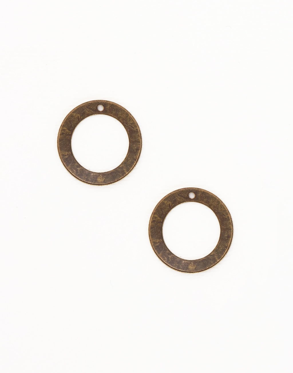 Two bronze circle pendants