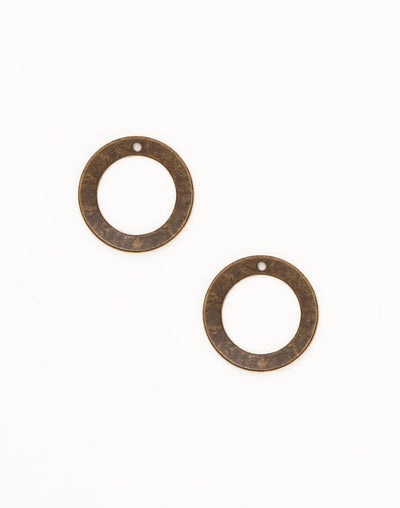 Two bronze circle pendants