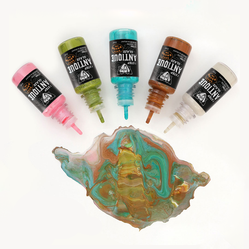 Antique glaze bottles and dried paint swatch