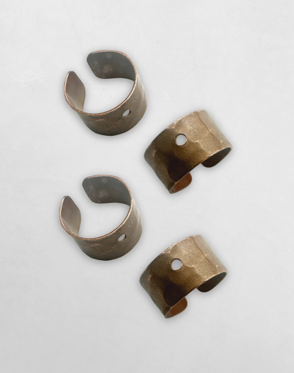 Set of four hammered metal rings