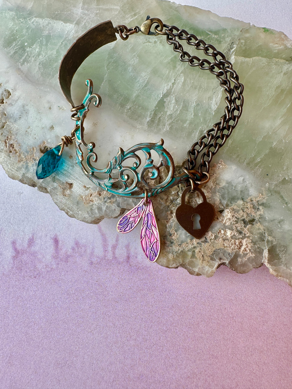 Vintage charm bracelet on stone