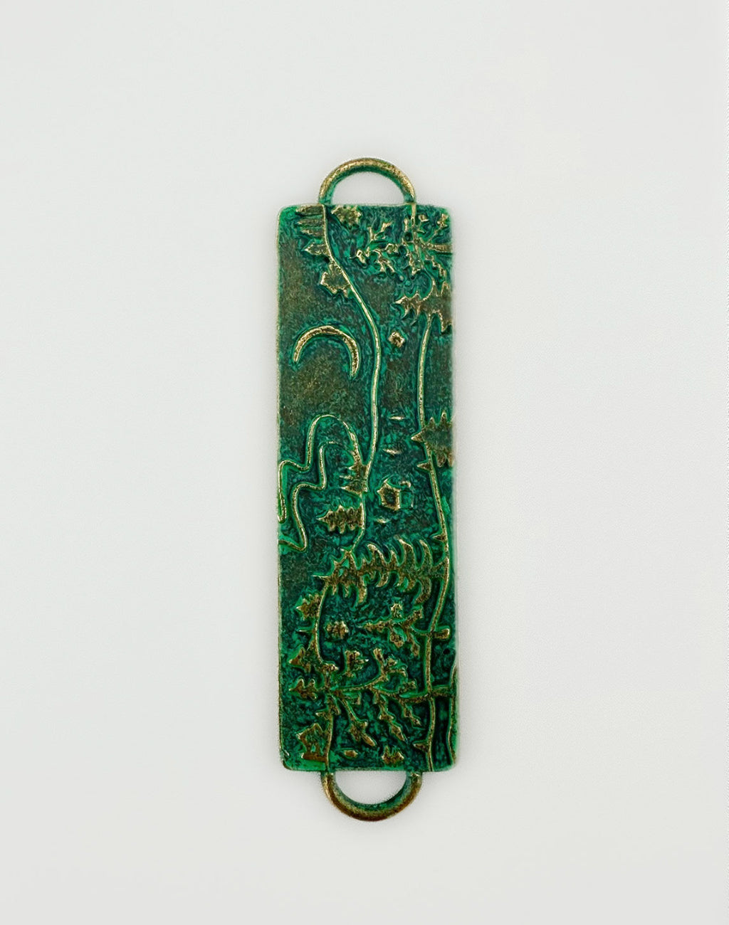 Green floral pendant with copper accents