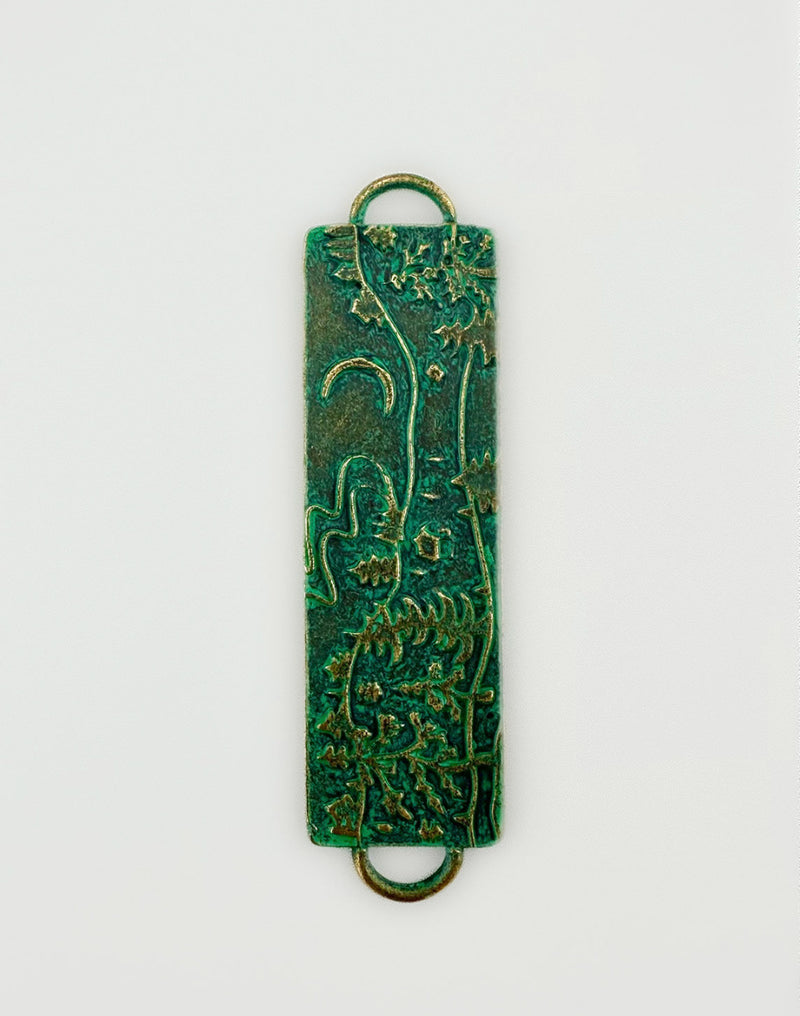 Green floral pendant with copper accents