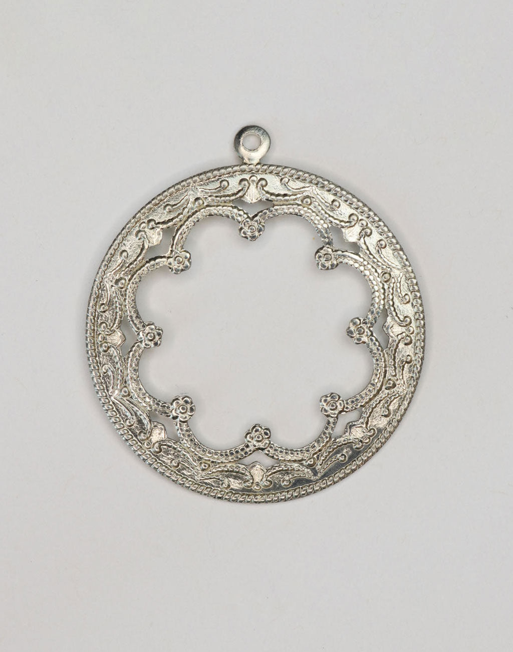 PT019 ornate silver pendant with openwork design.