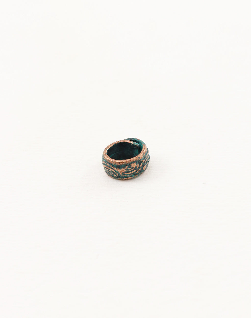 Ceramic ring with teal glaze and floral design