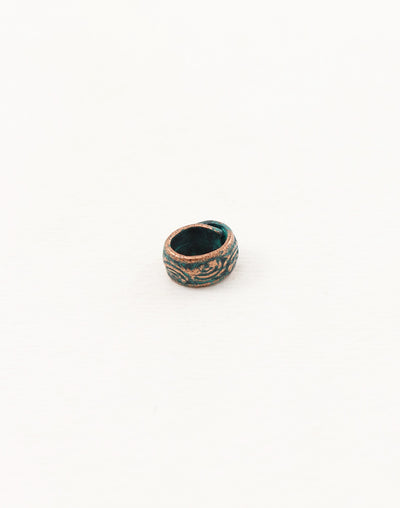 Ceramic ring with teal glaze and floral design