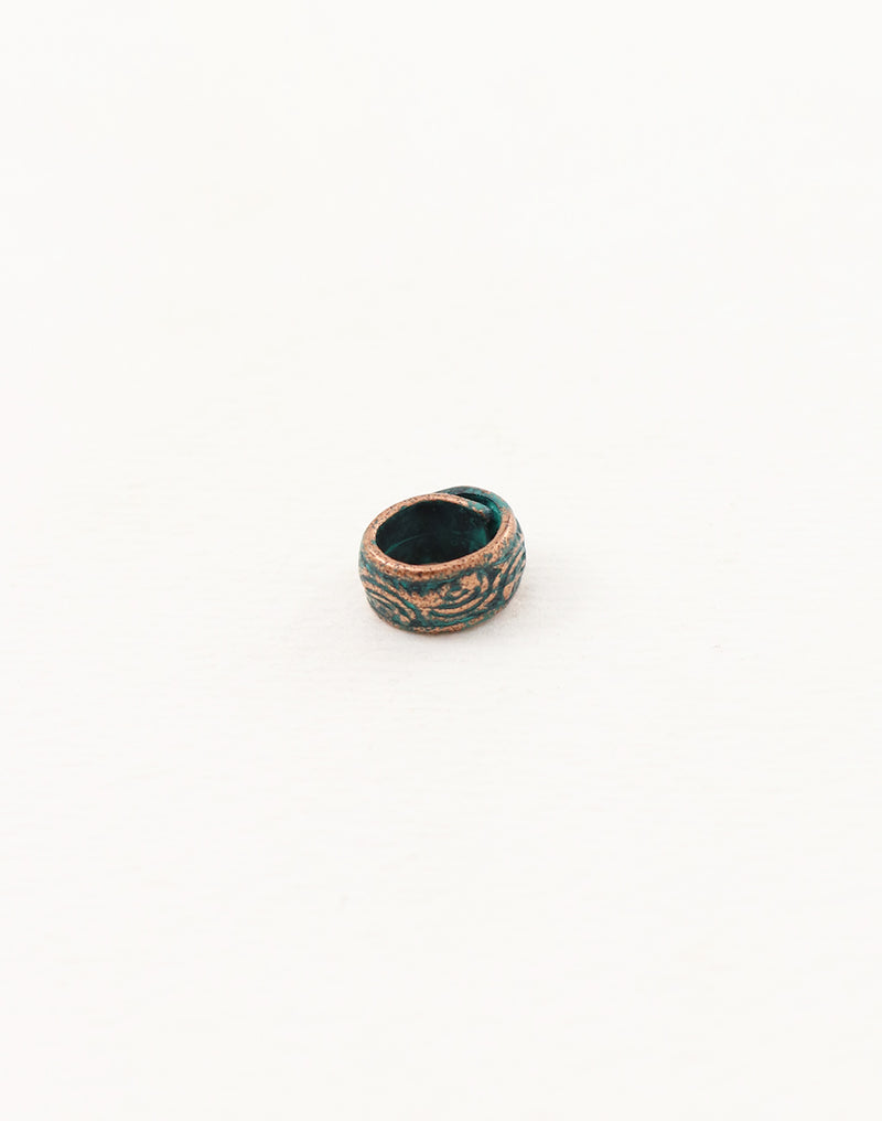 Ceramic ring with teal glaze and floral design