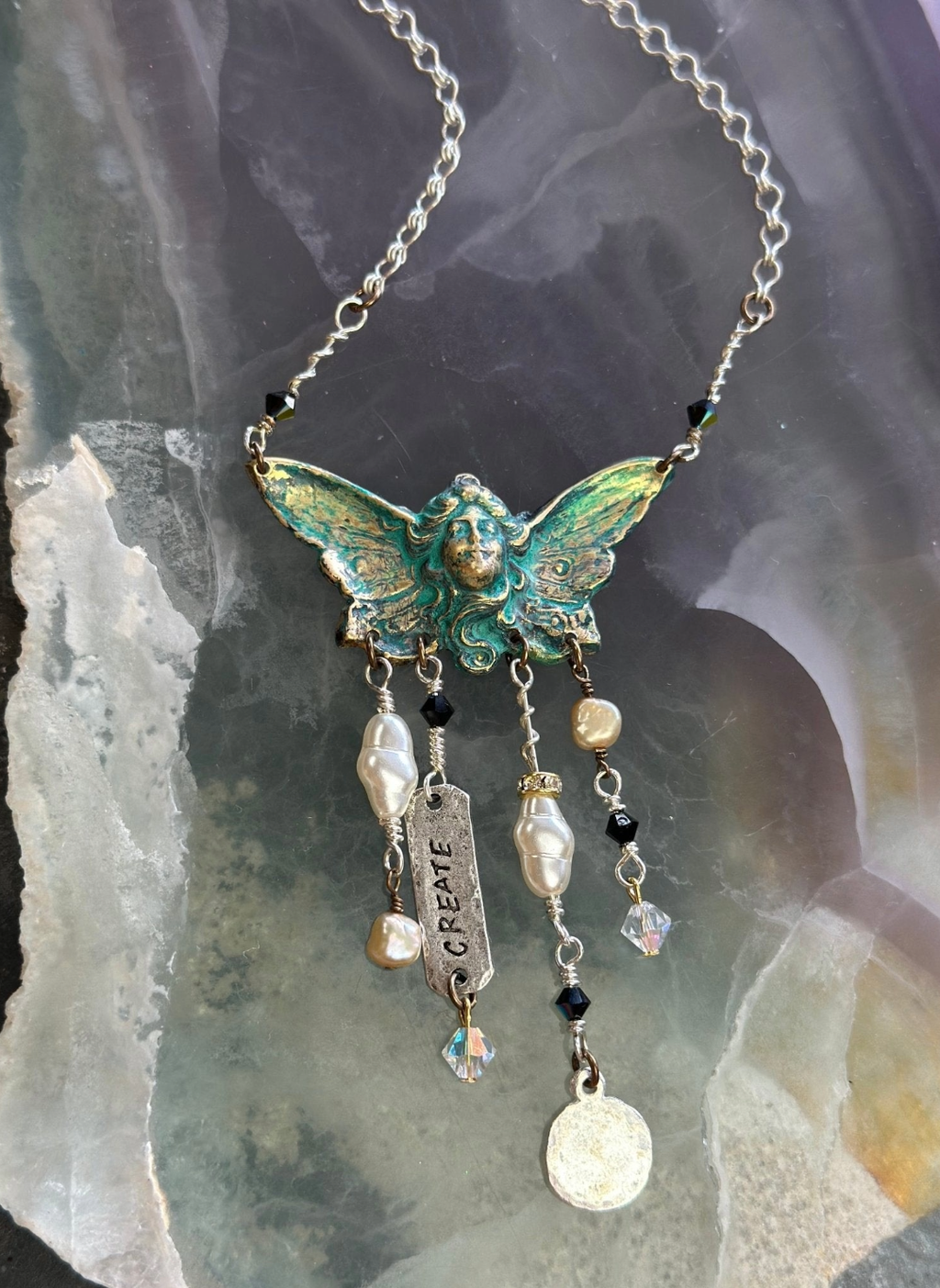 Angel wing necklace with Create charm.