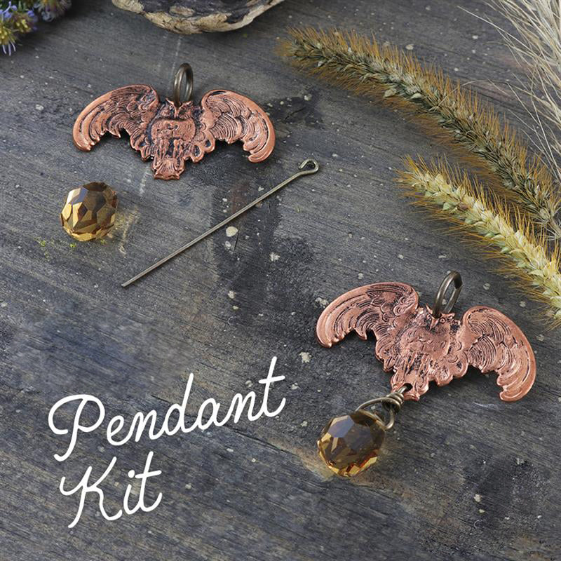 Two copper bat pendants, bead, pin, and text Pendant Kit.