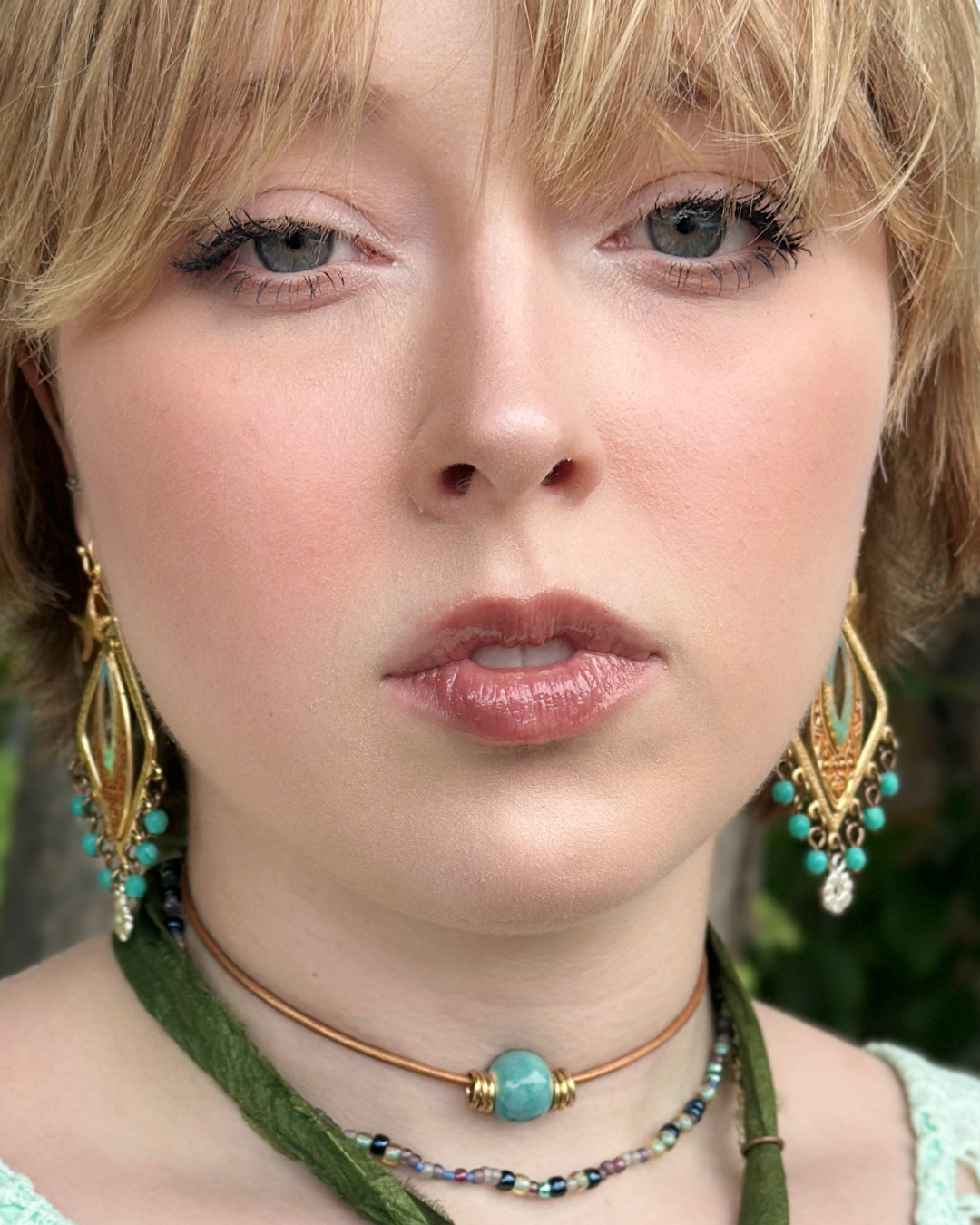 Trend-focused woman with earrings and choker, segment 14