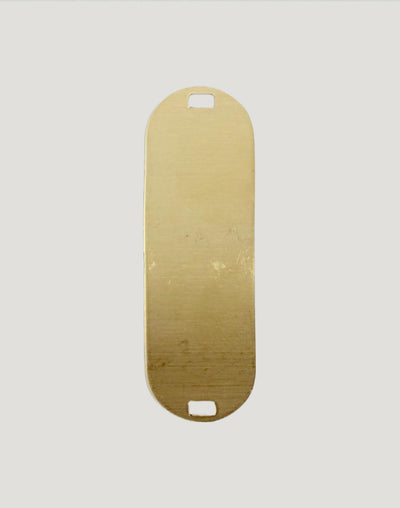 Gold oval tag with cutouts