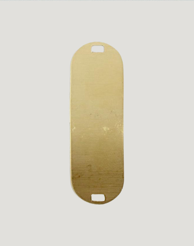 Gold oval tag with cutouts