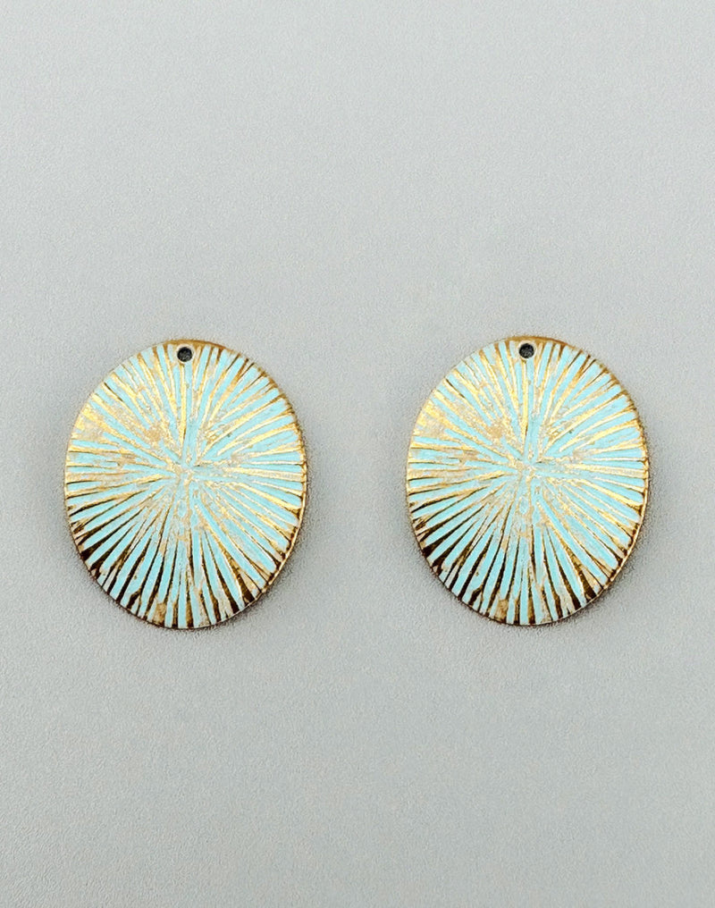 Light blue oval earrings with gold accents