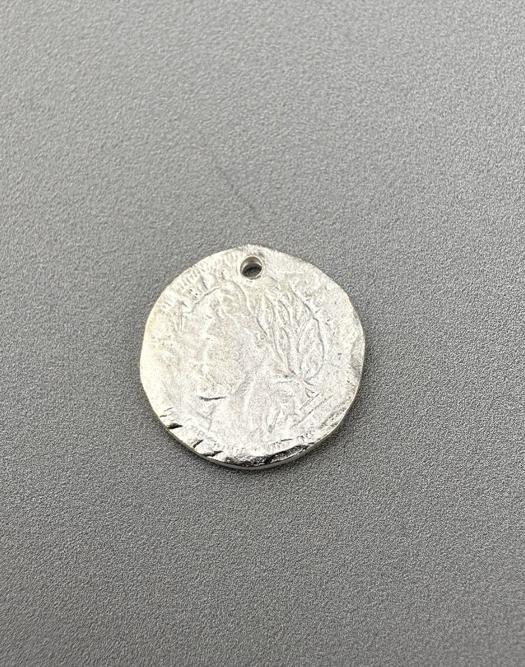Silver coin pendant