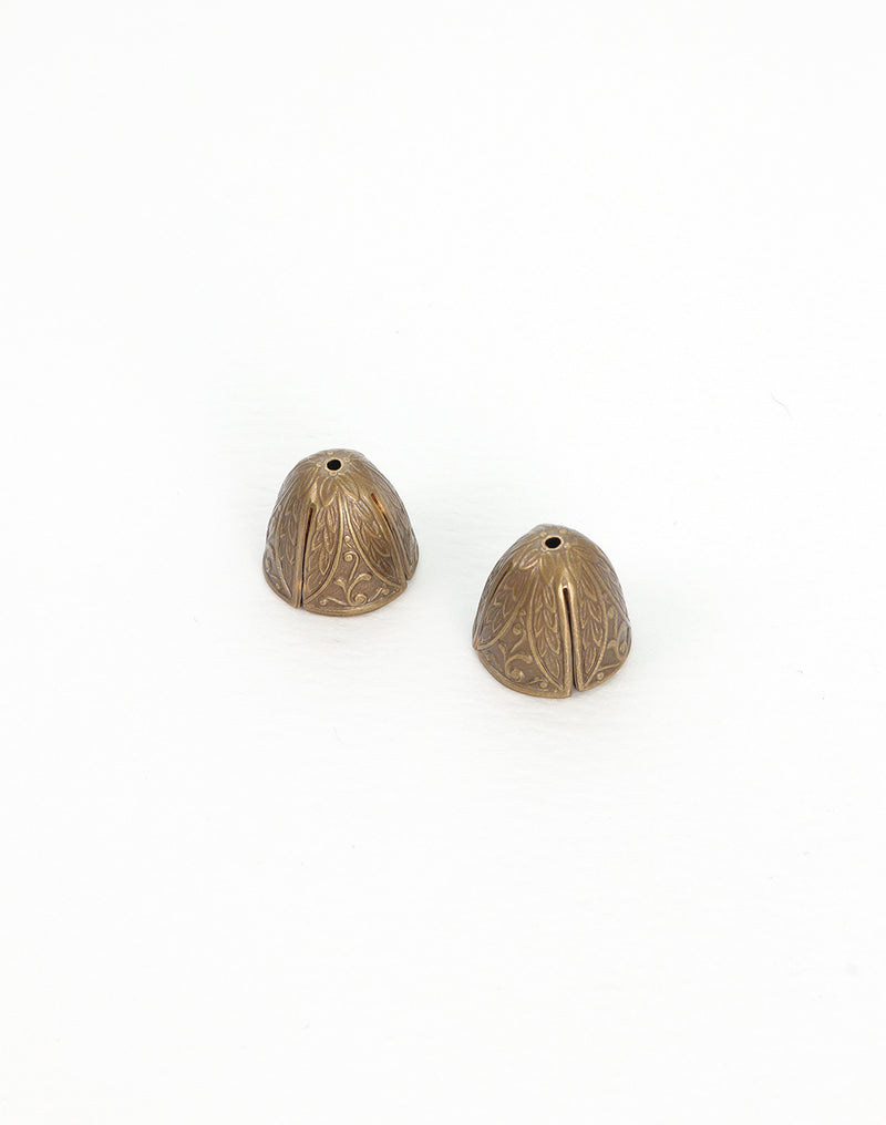 Two decorative bronze cone beads