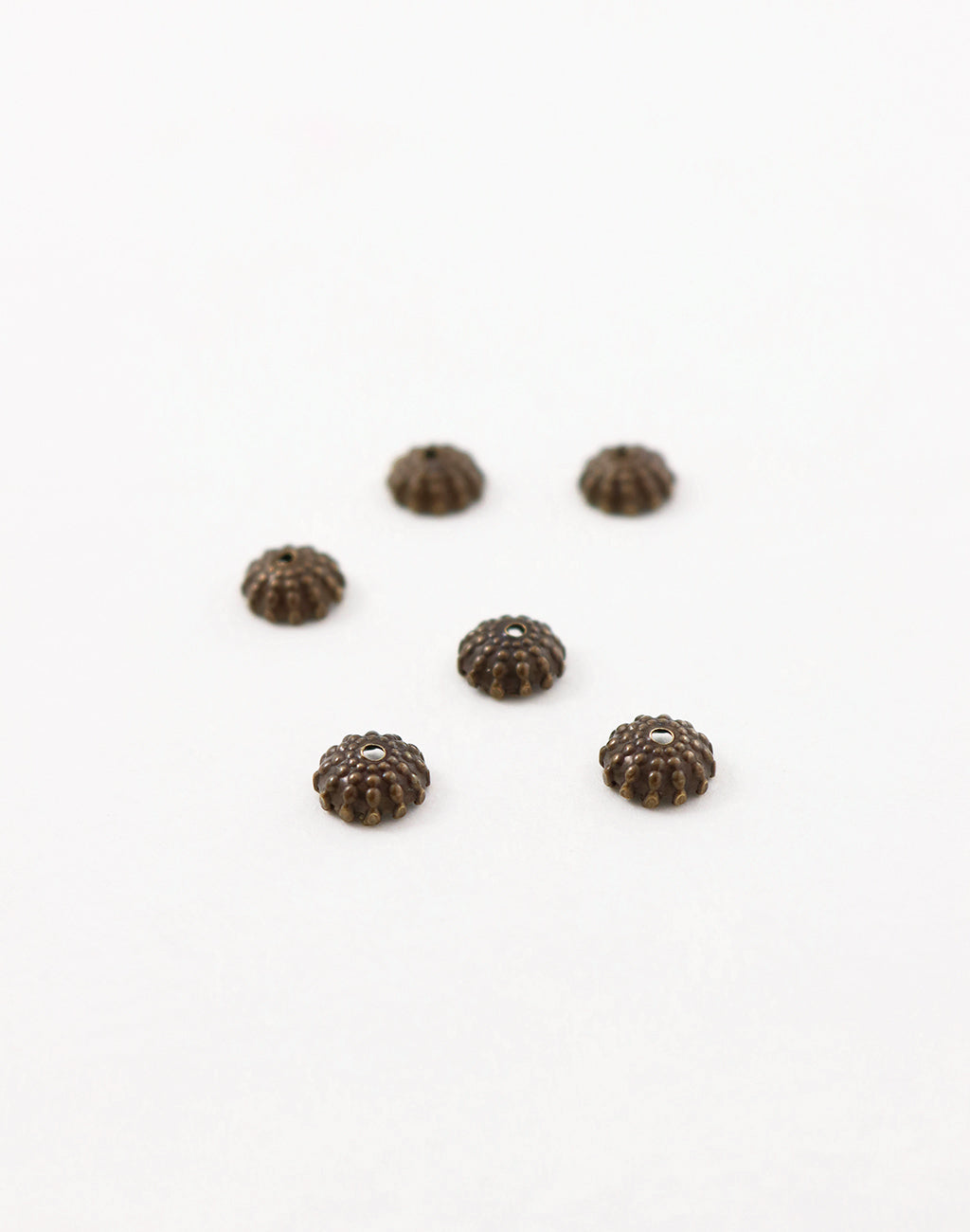 BC150 bead caps on white background