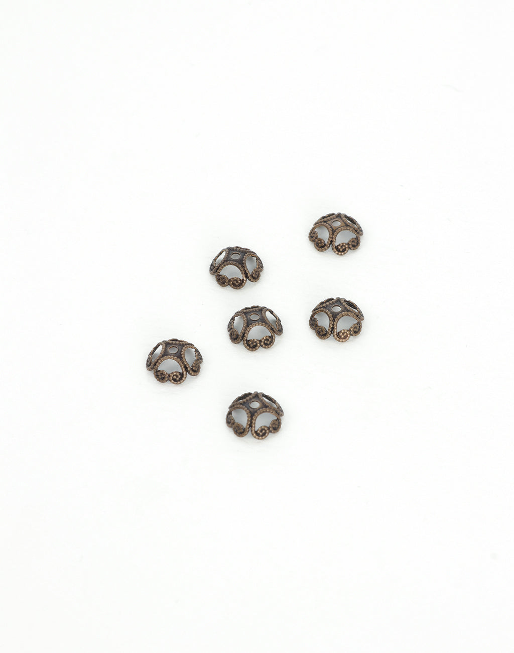 BC50 Antique bead caps on white