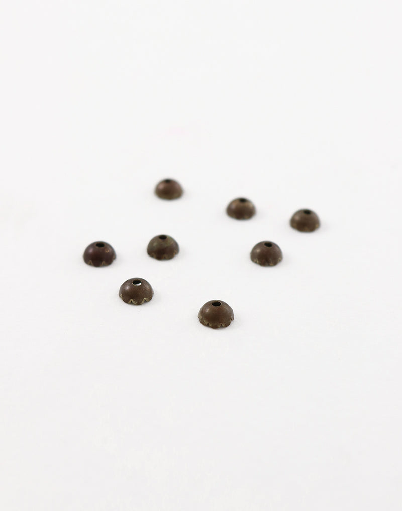 BC70 Brown bead caps on white background