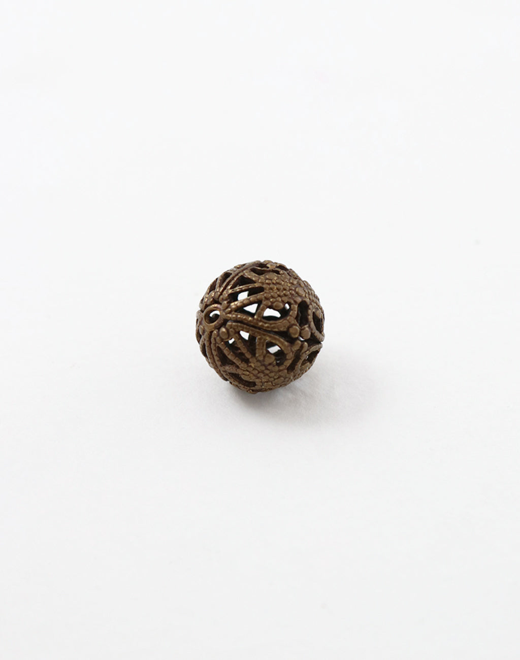 Decorative pierced ball on white background