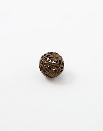 Decorative pierced ball on white background