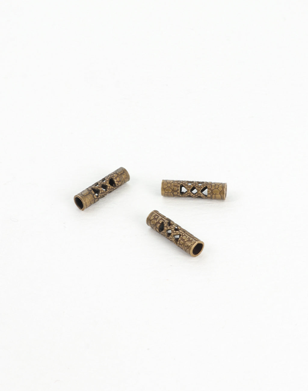 BD130 Bronze tube beads with intricate cut-out design