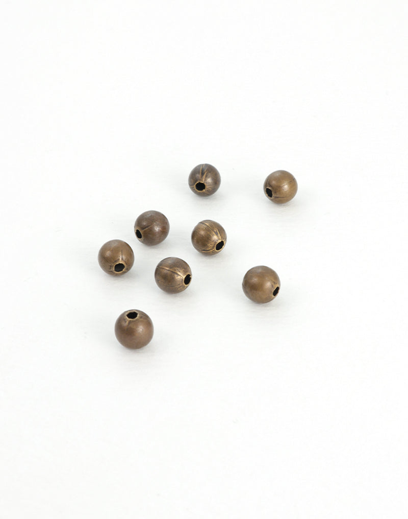 BD244 Bronze beads on white background.