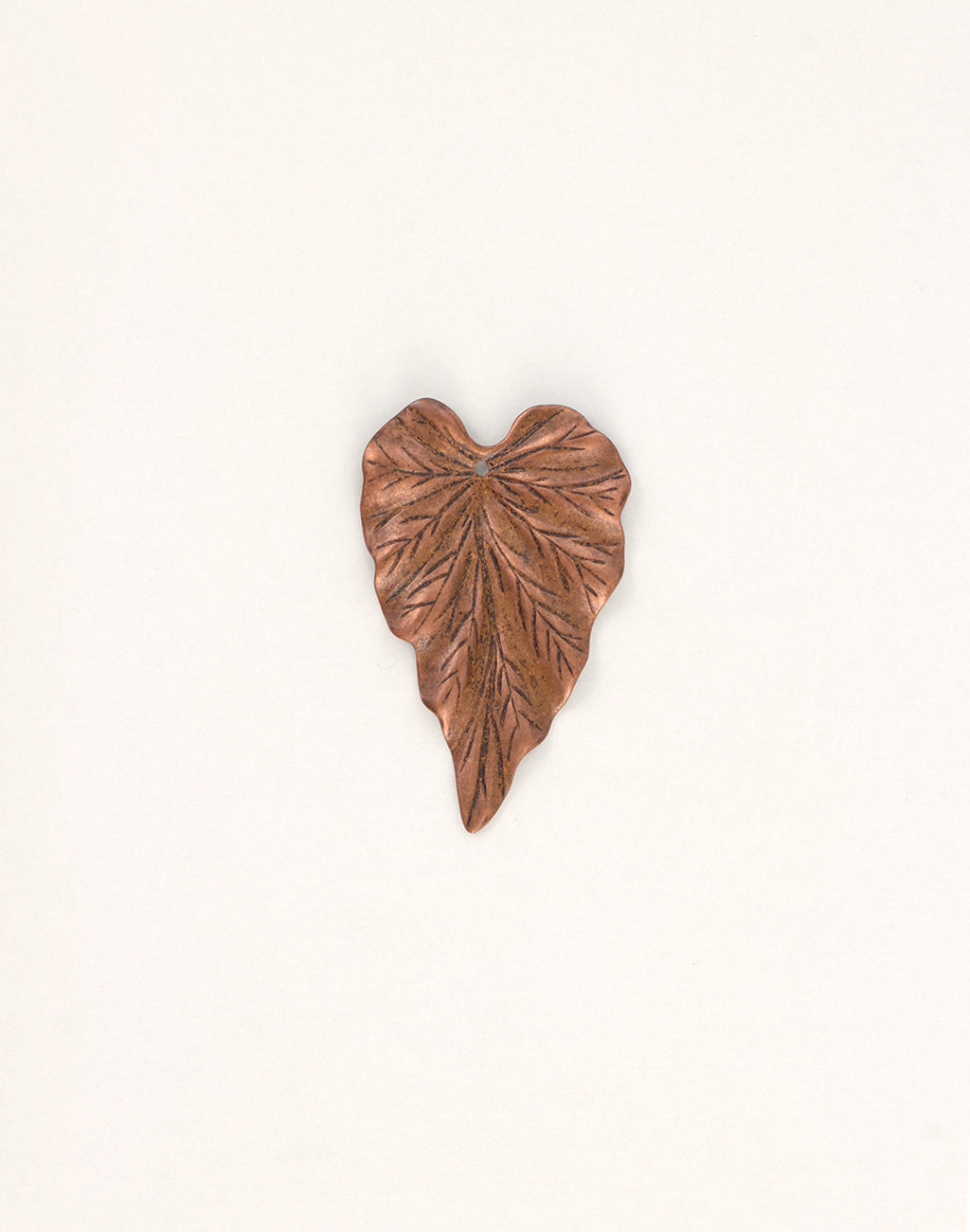 Copper leaf sculpture on white background