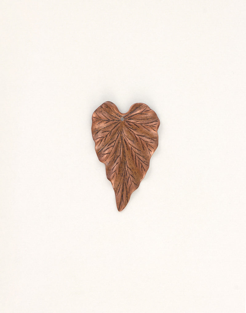 Copper leaf sculpture on white background