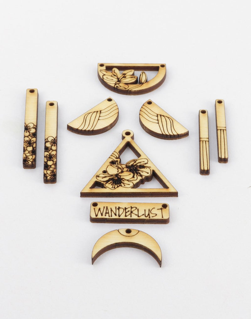 Laser-cut wooden jewelry components with floral & Wanderlust designs