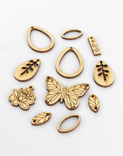 Laser-cut wooden jewelry charms (butterfly, leaves, ovals)