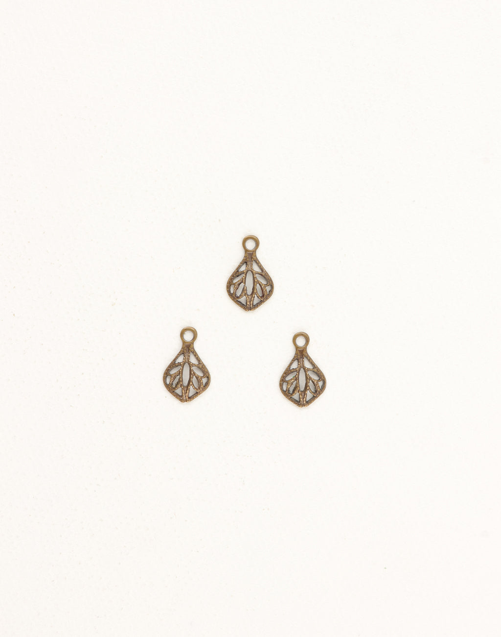 DP370 - Three small filigree charms