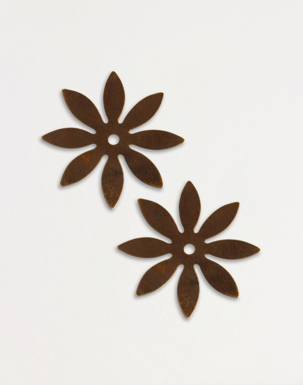 Pair of brown metal flower coasters