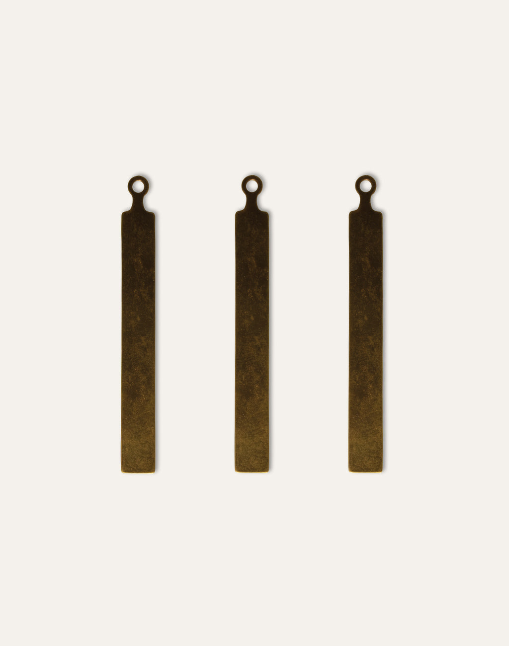 Three brass pendant blanks