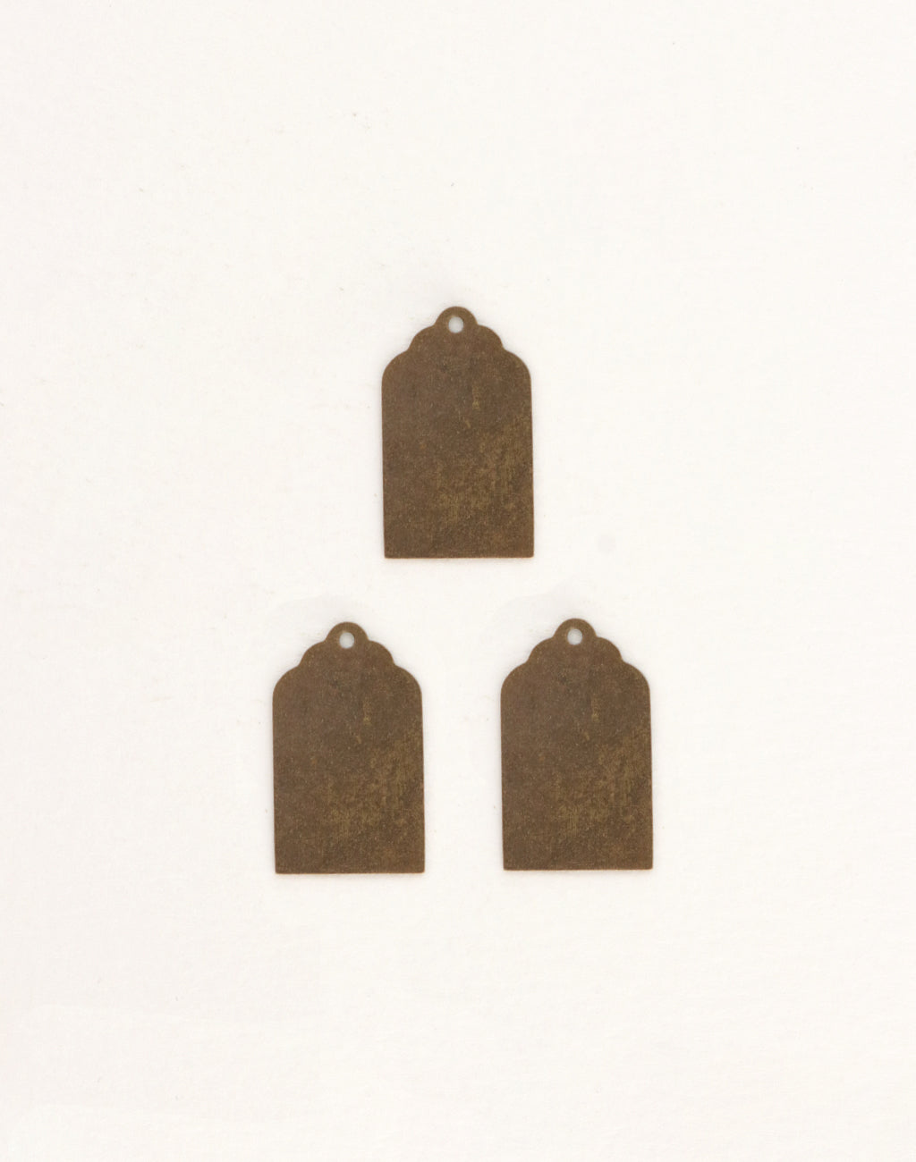 Three bronze decorative tags