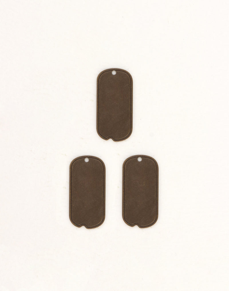 Three blank bronze dog tags on white background