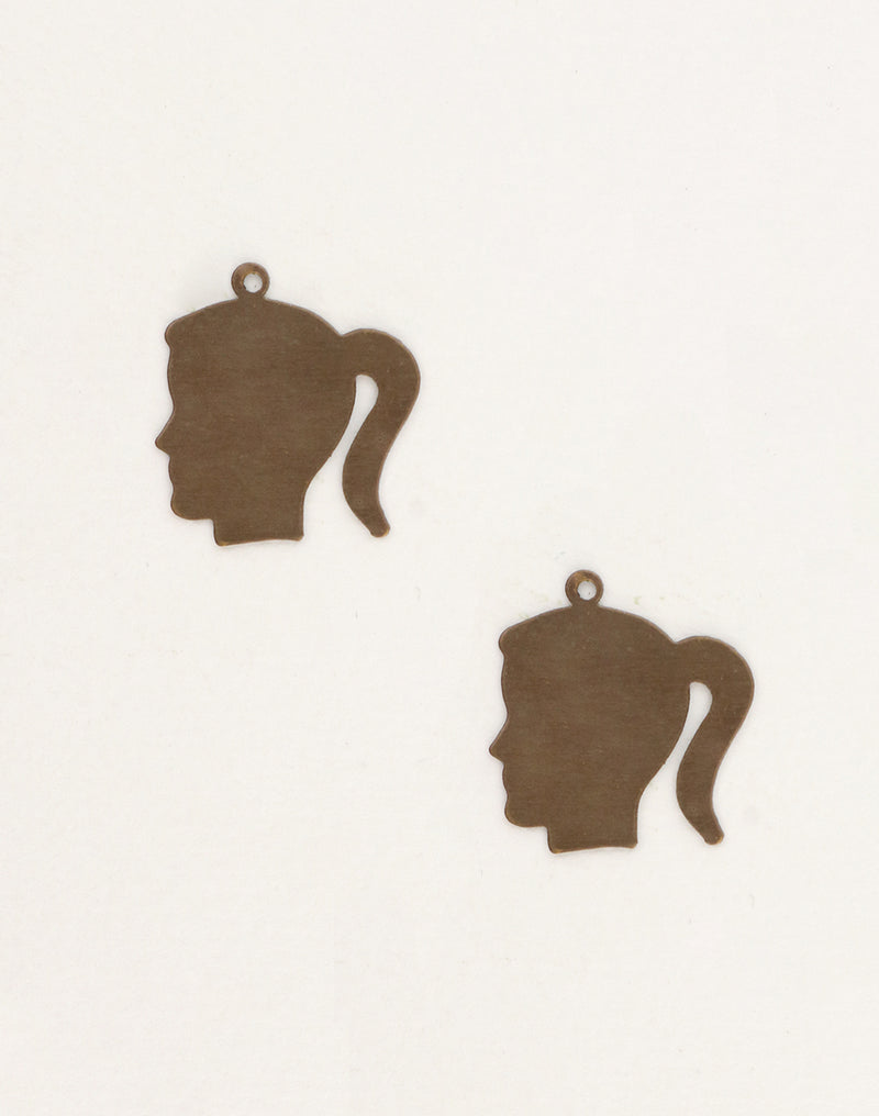 Two brown girl head silhouette pendants