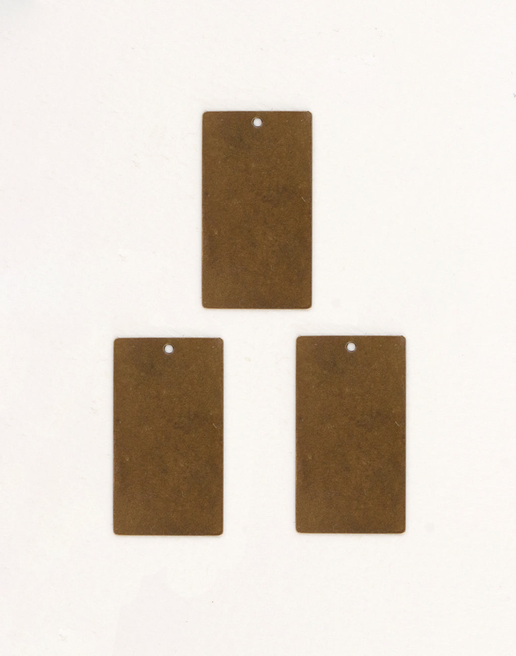 Three bronze rectangular tags