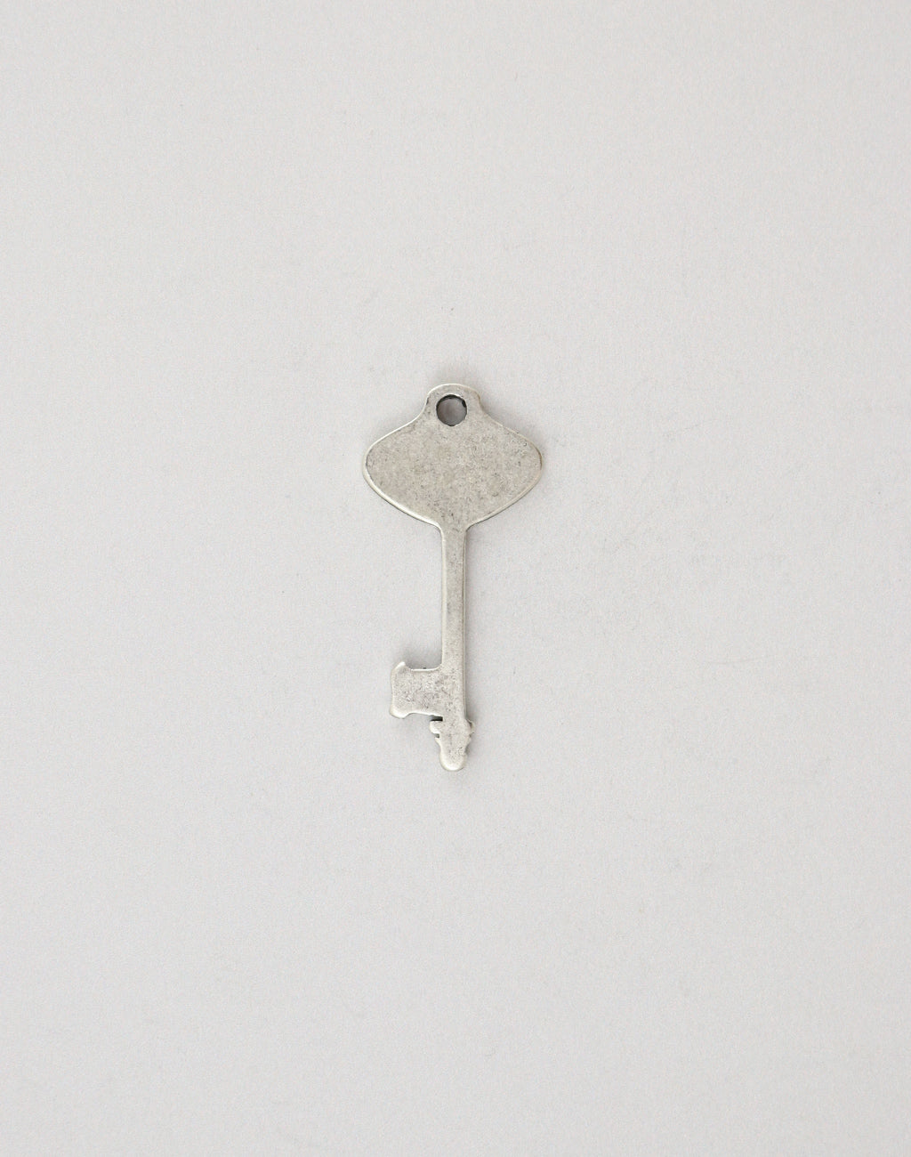 Vintage silver key charm