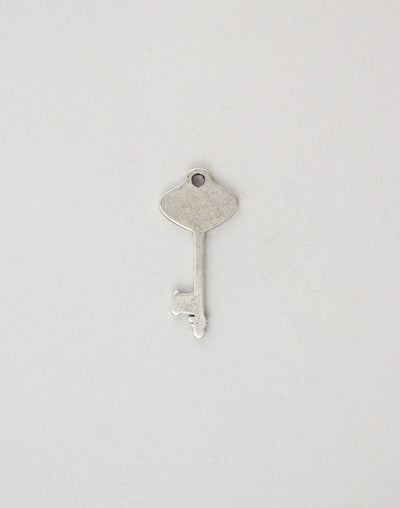 Vintage silver key charm