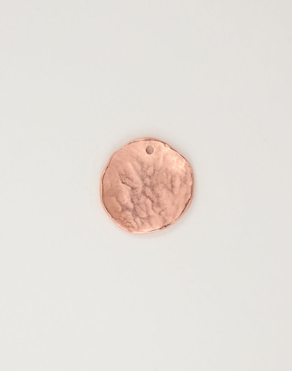 Copper disc pendant with textured surface