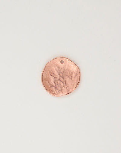 Copper disc pendant with textured surface