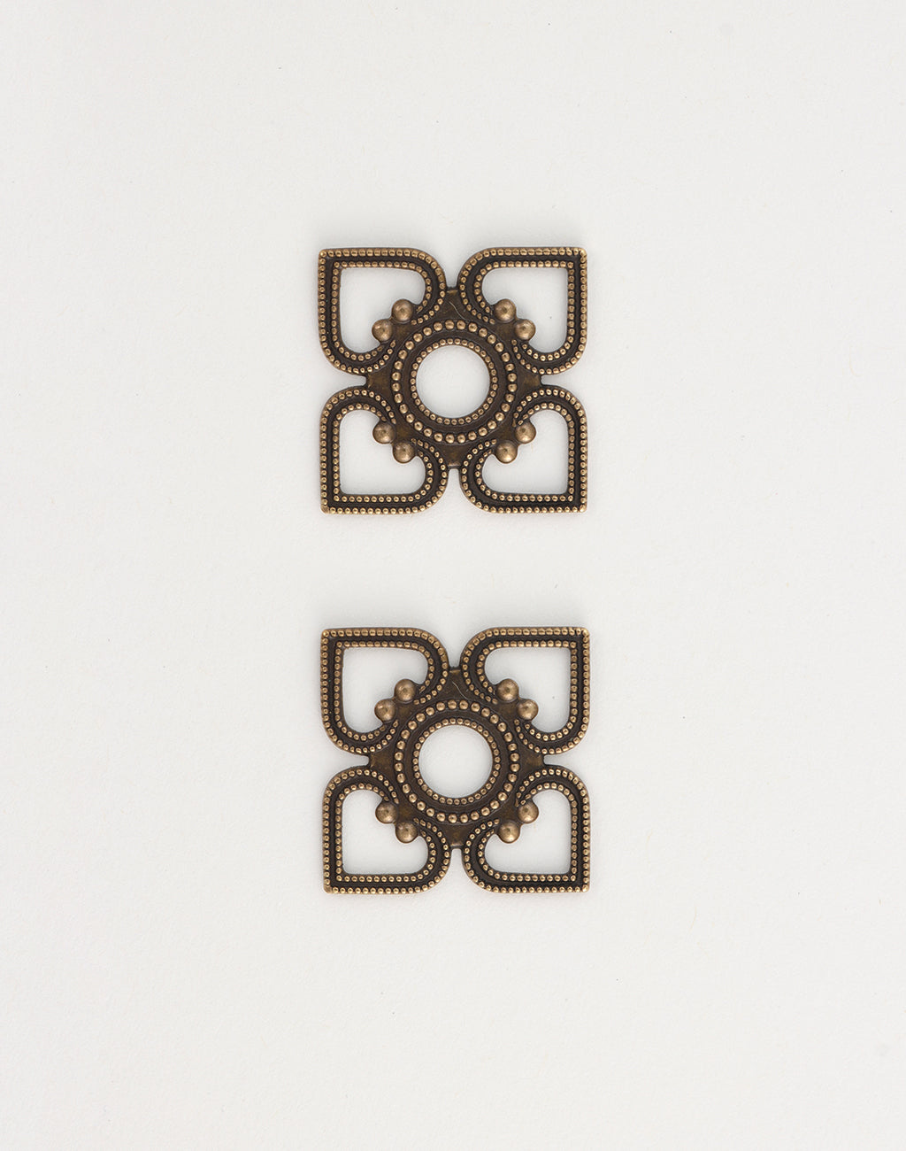 Two decorative bronze squares, em0040