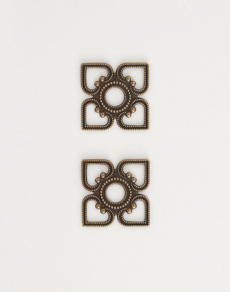 Two decorative bronze squares, em0040